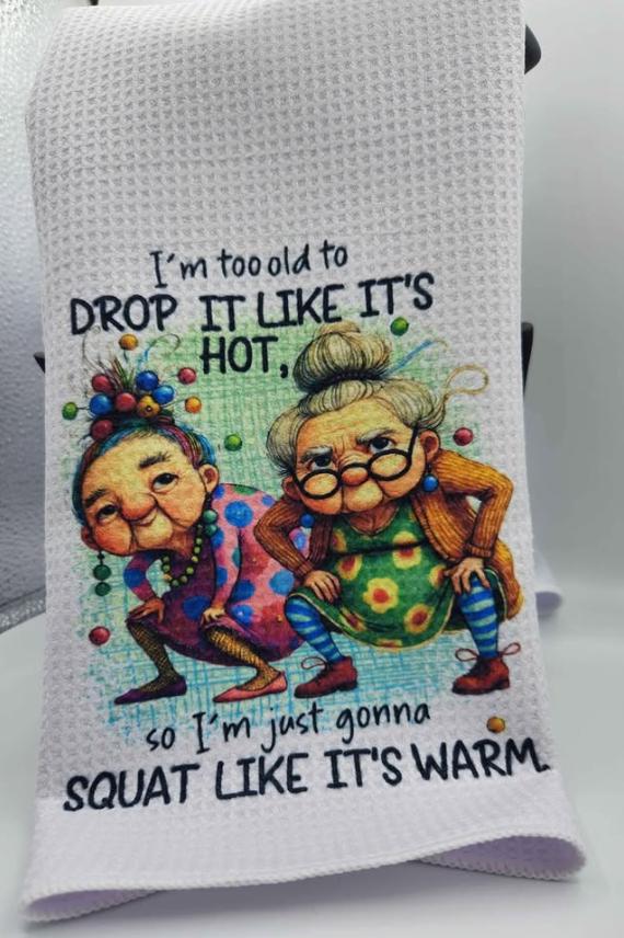 Funny Grandma Kitchen Towel – “Squat Like It’s Warm” Dish Towel – Humorous Tea Towel Gift for Mom, Best Friend, or Gag Gift